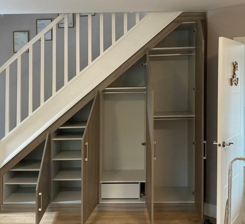 Fitted wardrobes under deals stairs