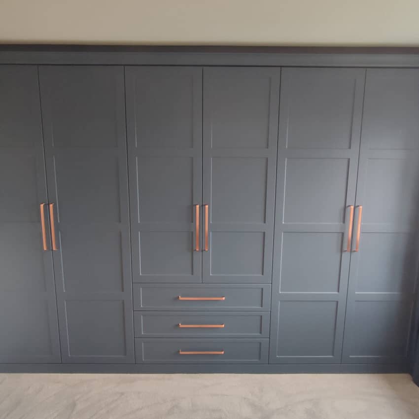 Elise Shaker Classic Blue fitted wardrobes over hidden chimney breast