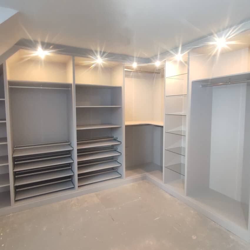 Fitted Wardrobes in a dressing room with fully lined backs