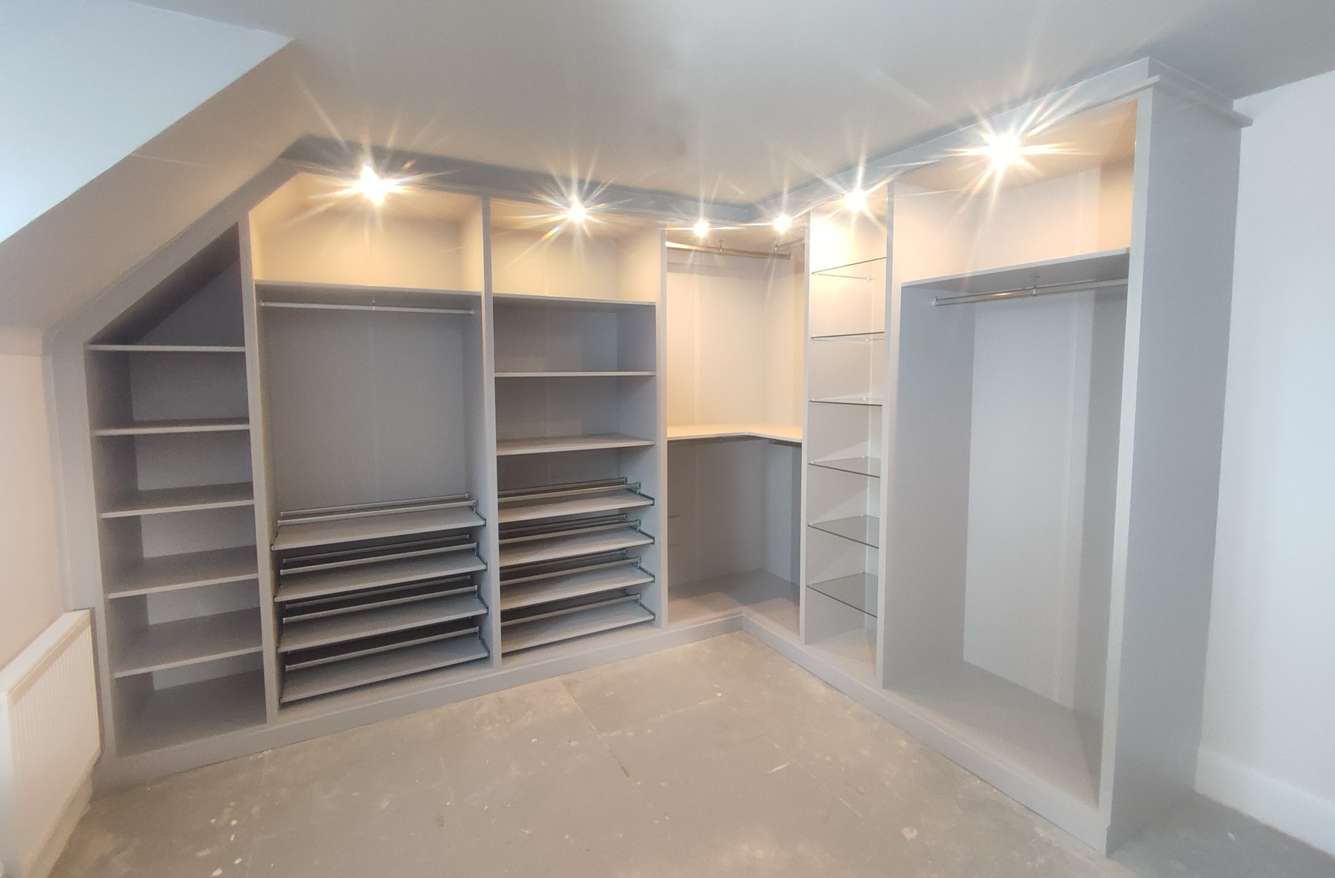 Fitted Wardrobes in a dressing room with fully lined backs