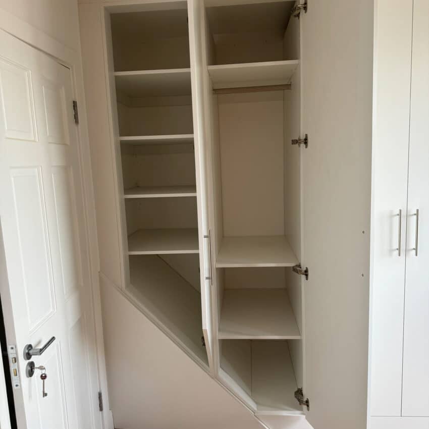 Bespoke Fitted Wardrobe with backs over a bulkhead