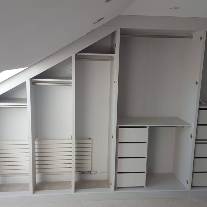 Customised Fitted wardrobes in loft room designer around radiator