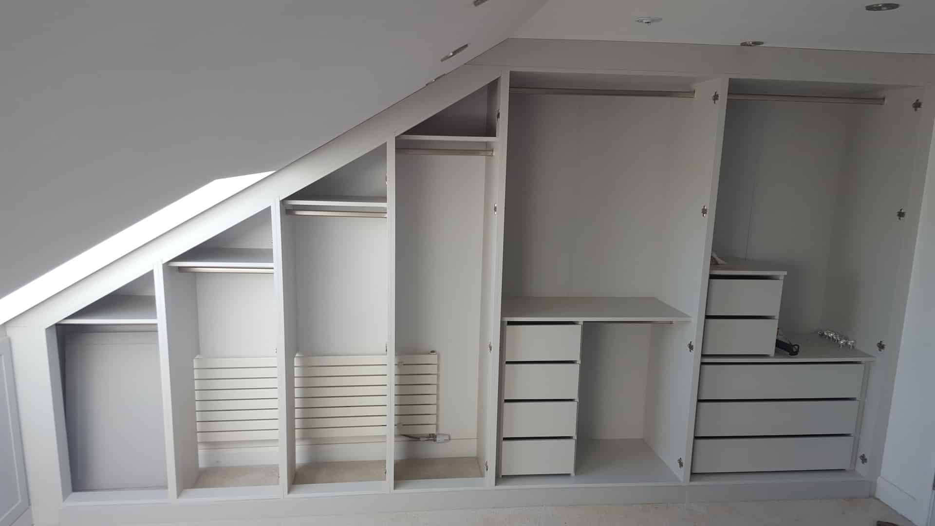 Customised Fitted wardrobes in loft room designer around radiator